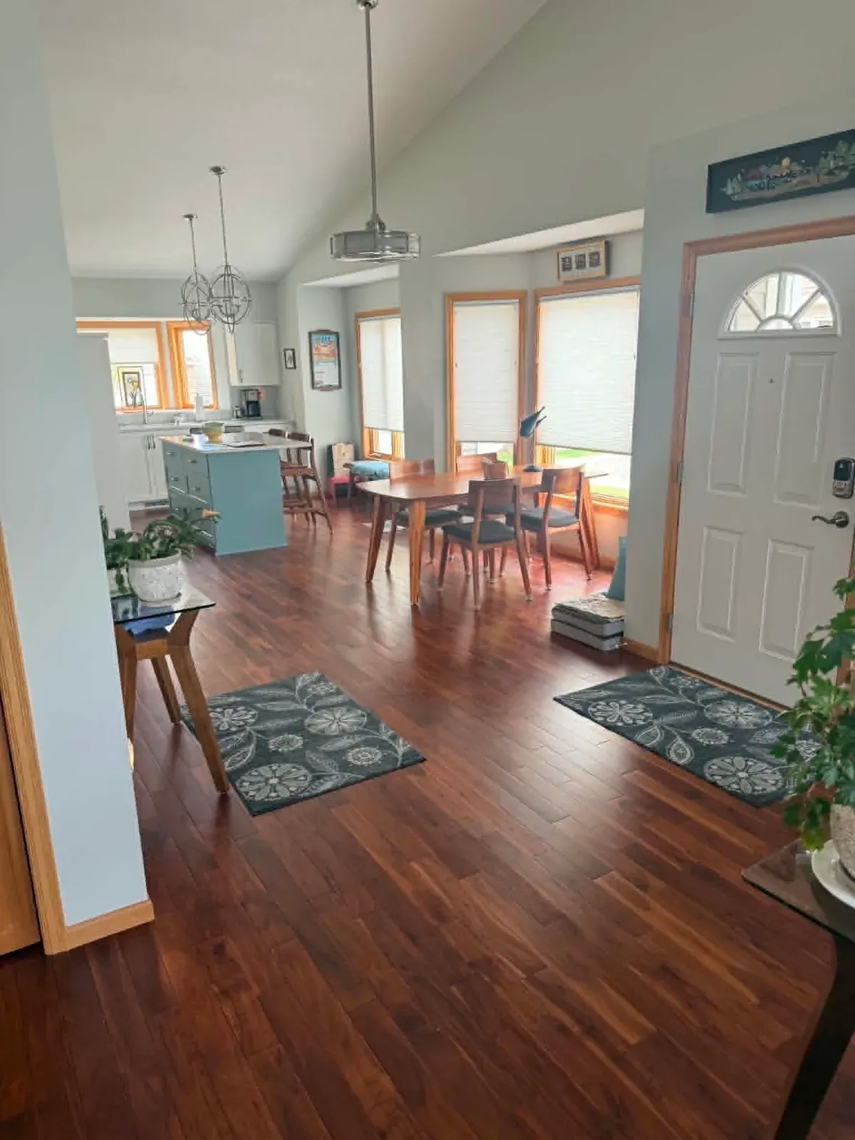 Dining room and entryway with new hardwood flooring installed